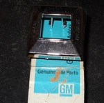Nos 1977-80 Chevrolet Station Wagon Back Seat Release Escutcheon. Fixed Price $35.00.