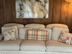 Beige Patterned 3-SEAT Sofa, Skirted Fabric Upholstery, Cushioned Back. Fixed Price $250.00.