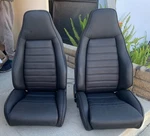 Recovered Porsche 911 930 '74-'77 Black Leather Front Sport Seats. Fixed Price $8999.99.